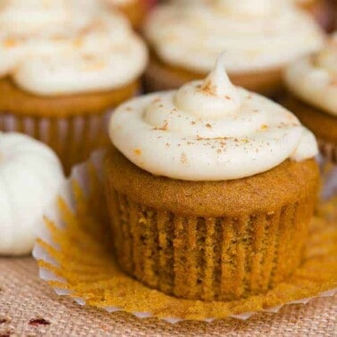 Pumpkin Cupcakes with a Citrus Cream Cheese Frosting with muffin liner pulled down