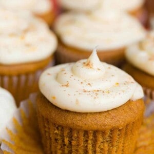 Pumpkin Cupcakes with a Citrus Cream Cheese Frosting with muffin liner pulled down