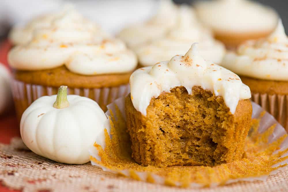 Pumpkin Cupcakes with a Citrus Cream Cheese Frosting with bite taken out