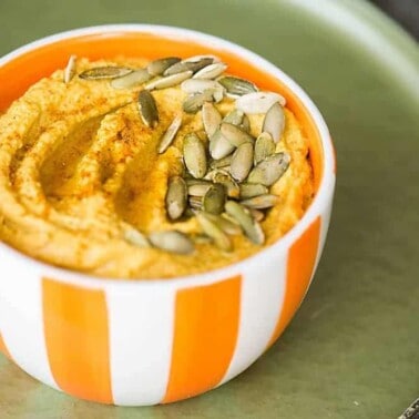 Pumpkin Curry Hummus is a great healthy snack. By adding pumpkin puree and curry powder to this homemade blend you end up with the perfect fall appetizer.