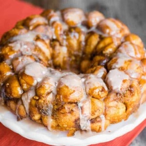 plate with homemade pumpkin spice monkey bread with cinnmon glaze