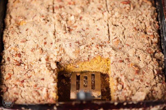 A close up of a piece of coffee cake with pumpkin