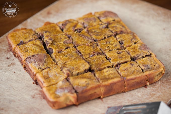 pumpkin swirl brownies on a wooden cutting board