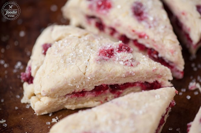 A close up of a raspberry scone