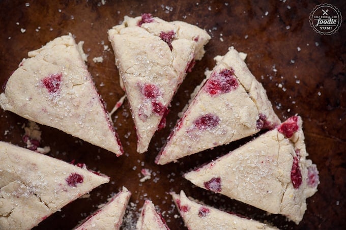 sliced raspberry lemon scones on brown baking pan