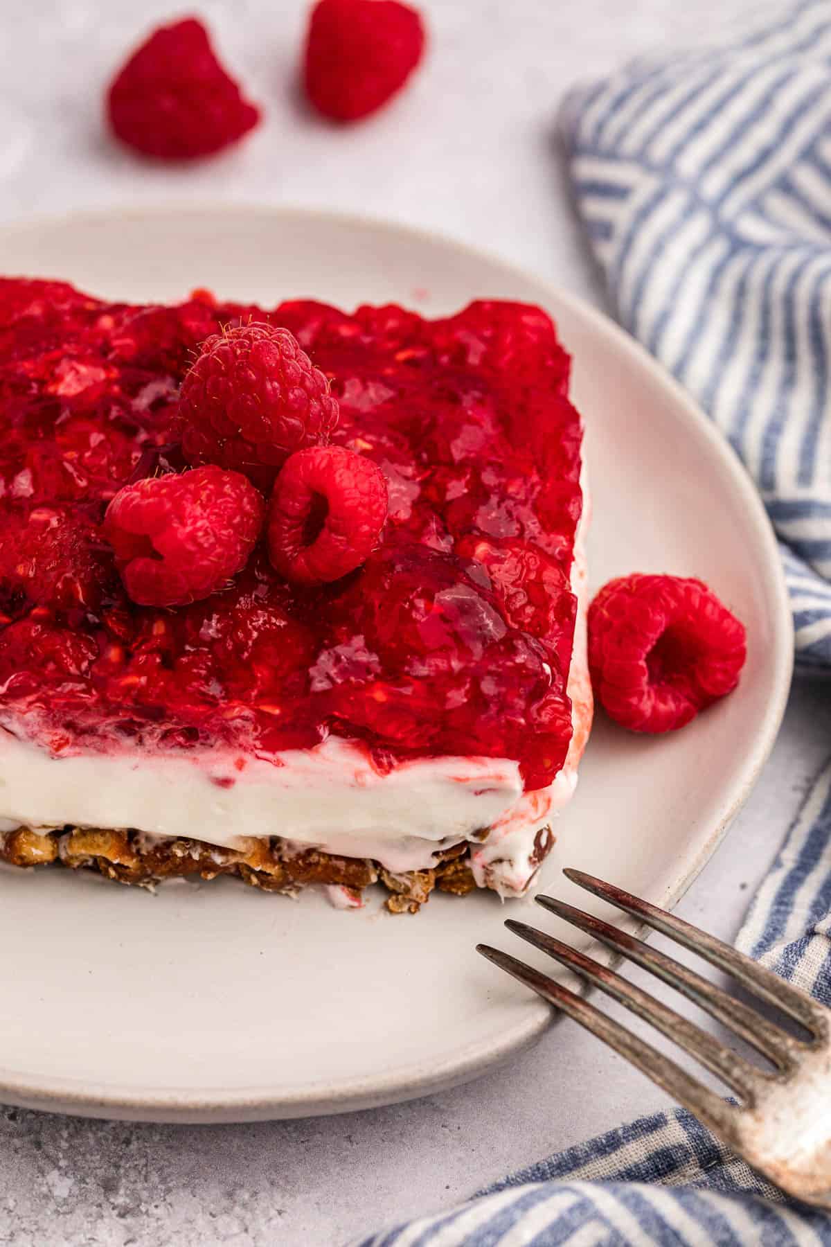 piece of raspberry pretzel dessert salad on plate.