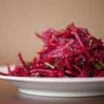 shredded beet salad on white plate