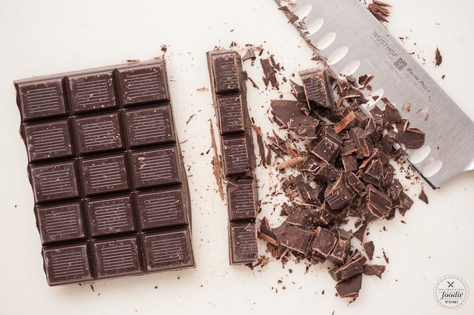 dark chocolate cut with chef's knife for red velvet chocolate cookie recipe