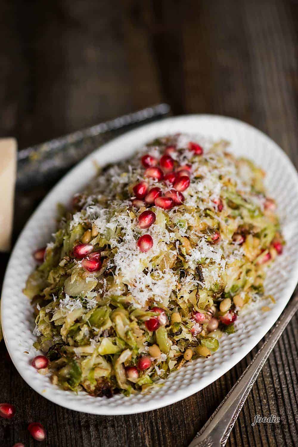 Roasted Brussels Sprouts Salad with parmesan, pomegranate, and a light lemon vinaigrette, is the perfect salad for any holiday or family dinner.