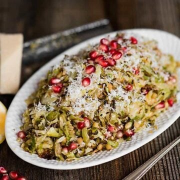 Roasted Brussels Sprouts Salad with parmesan, pomegranate, and a light lemon vinaigrette, is the perfect salad for any holiday or family dinner.