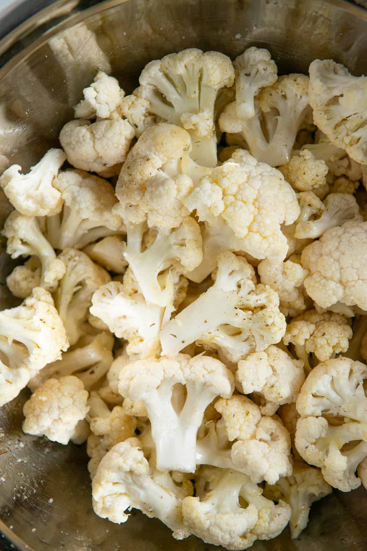 cauliflower pieces tossed with olive oil and salt.