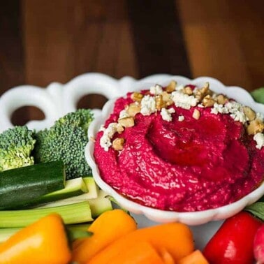 If you're looking for a vibrant, healthy, and tasty appetizer that's easy to make, look no further than this Roasted Garlic Beet Hummus.