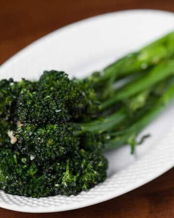 A side dish of tender Roasted Garlic Broccolini is not only super easy to make, but it is a delicious dark green vegetable perfect for any family dinner.