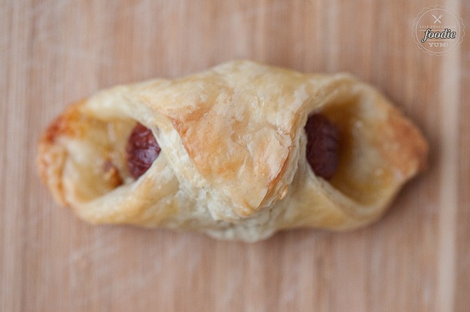 looking down at a cocktail weiner wrapped in puff pastry