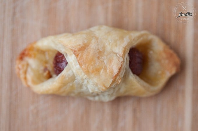 looking down at a cocktail weiner wrapped in puff pastry