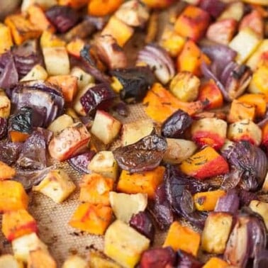Fall is the perfect time to enjoy a rainbow of healthy Roasted Root Vegetables as a perfect side dish to any weekday family dinner or holiday meal.