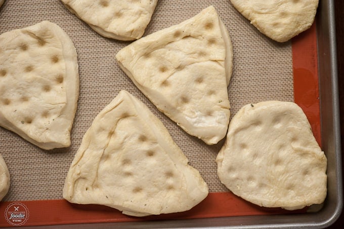 flat bread on baking sheet before cooking