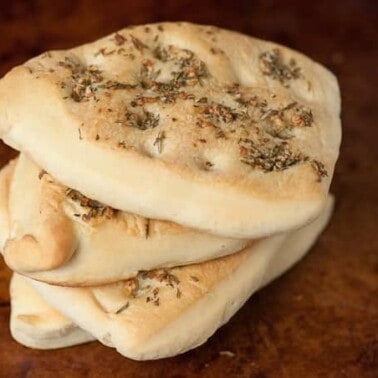 Homemade Rosemary Focaccia Flatbread is a rich and savory flat bread that has the same great olive oil taste as fluffy focaccia, but its more dense.
