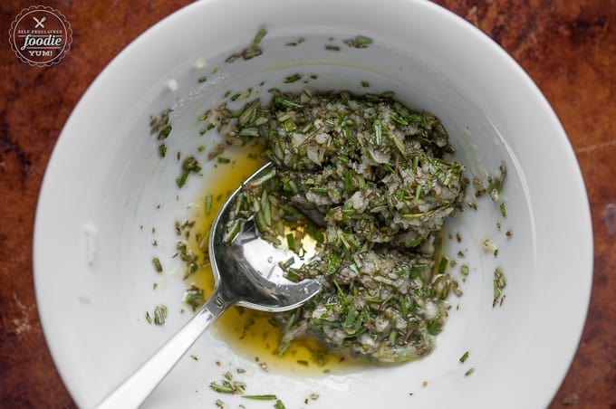 A bowl of rosemary, salt and olive oil