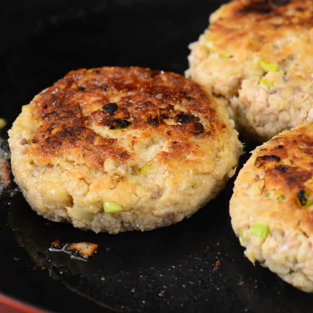 cooking salmon patties in fry pan