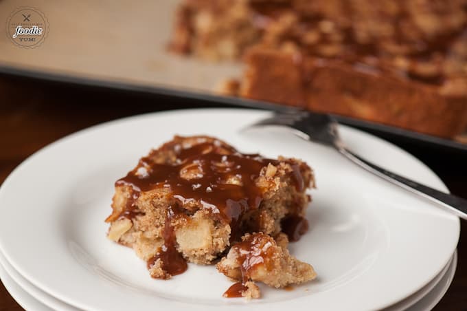 A piece of cake on a plate, with Caramel and Apple cake