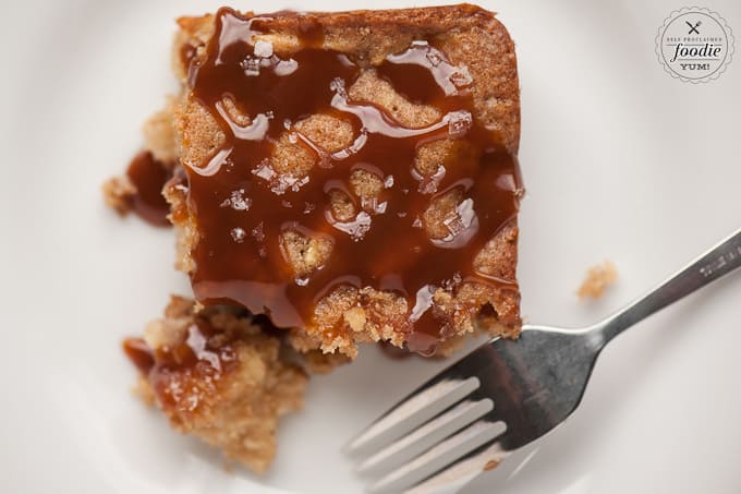 looking down at a serving of apple cake with caramel sauce