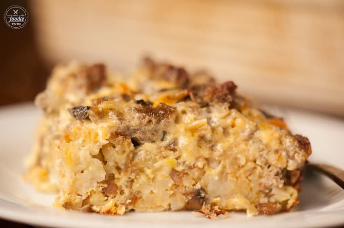 close up of sausage tater tot breakfast that is cooked as a casserole