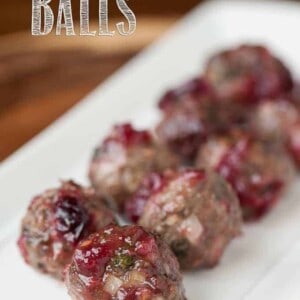 a platter of beef cocktail meatballs with cranberry sauce