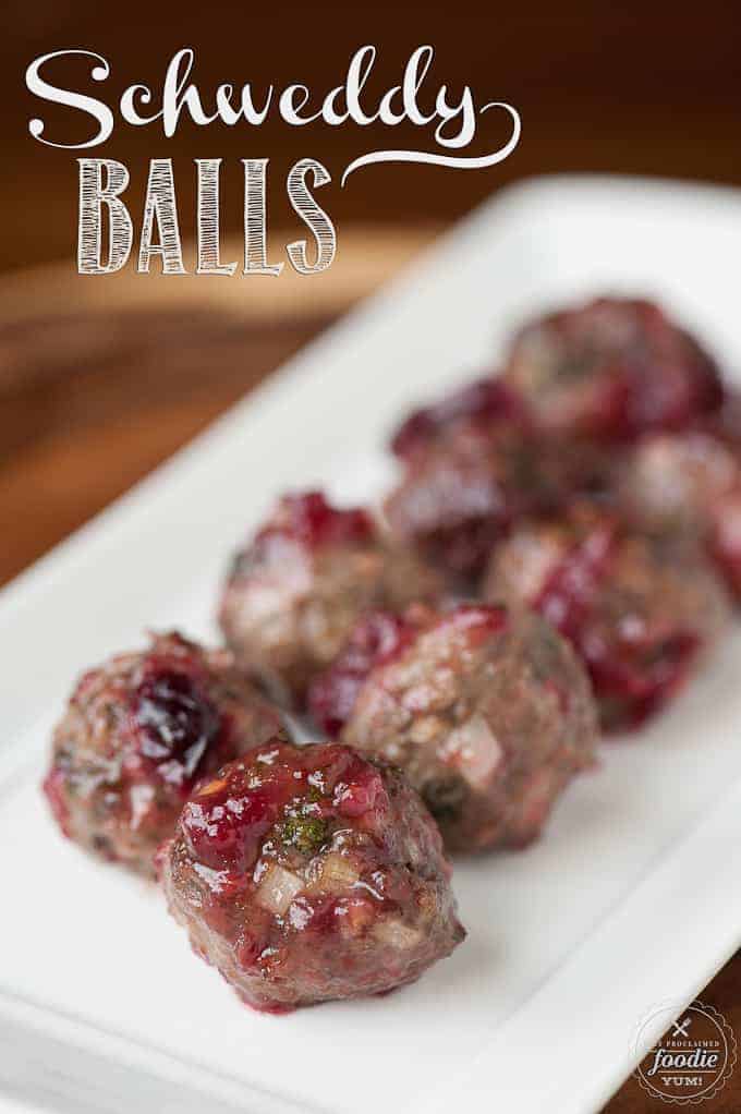 a platter of beef cocktail meatballs with cranberry sauce