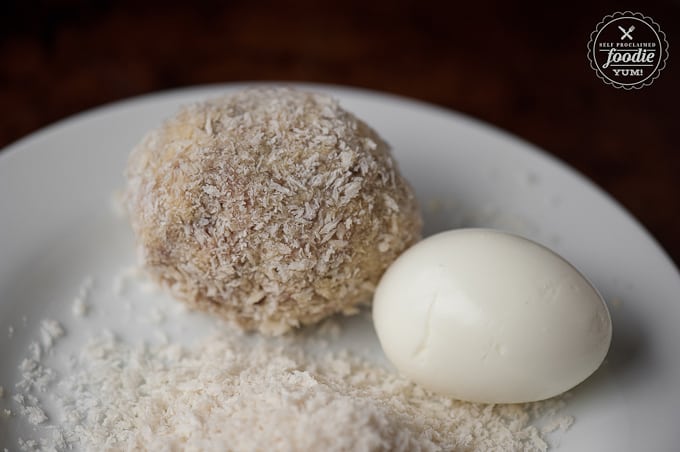 hard boiled egg next to scotch egg about ready to be fried