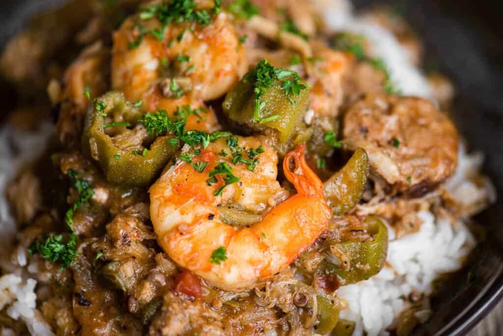 Homemade Seafood Gumbo with shrimp, crab, Andouille sausage, and okra over rice.