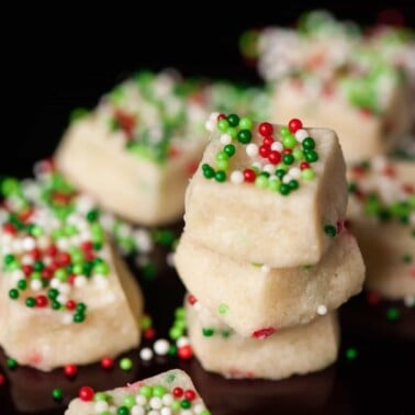 stack of square cookies with christmas sprinkles