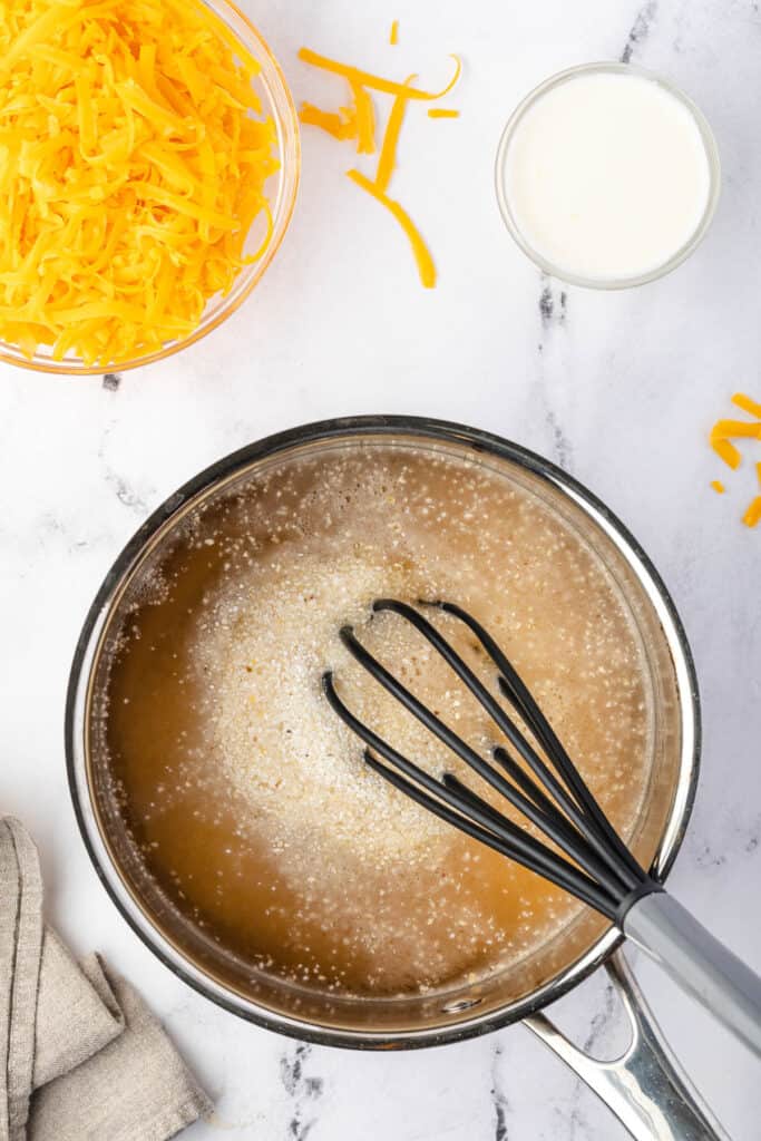 adding grits to hot cooking liquid