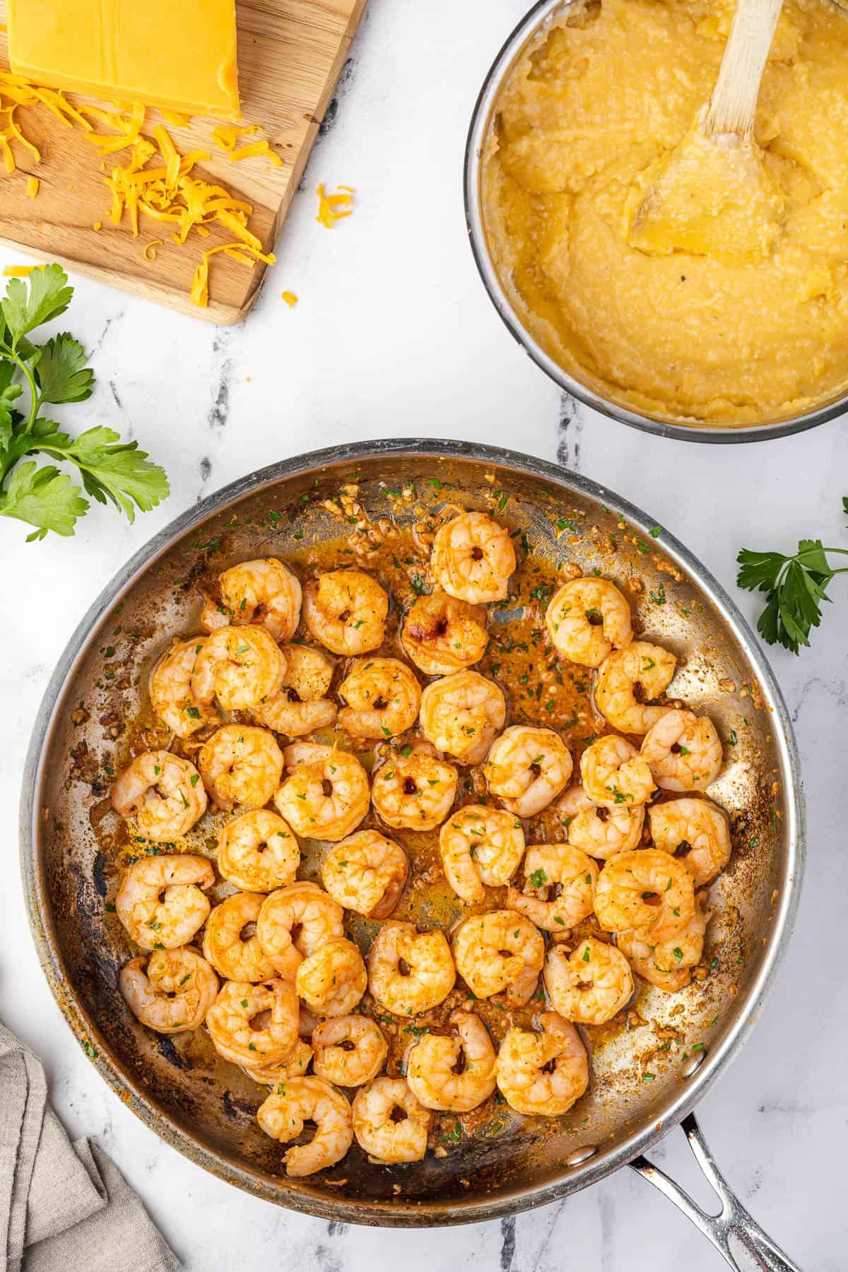 seared shrimp in a skillet after turning