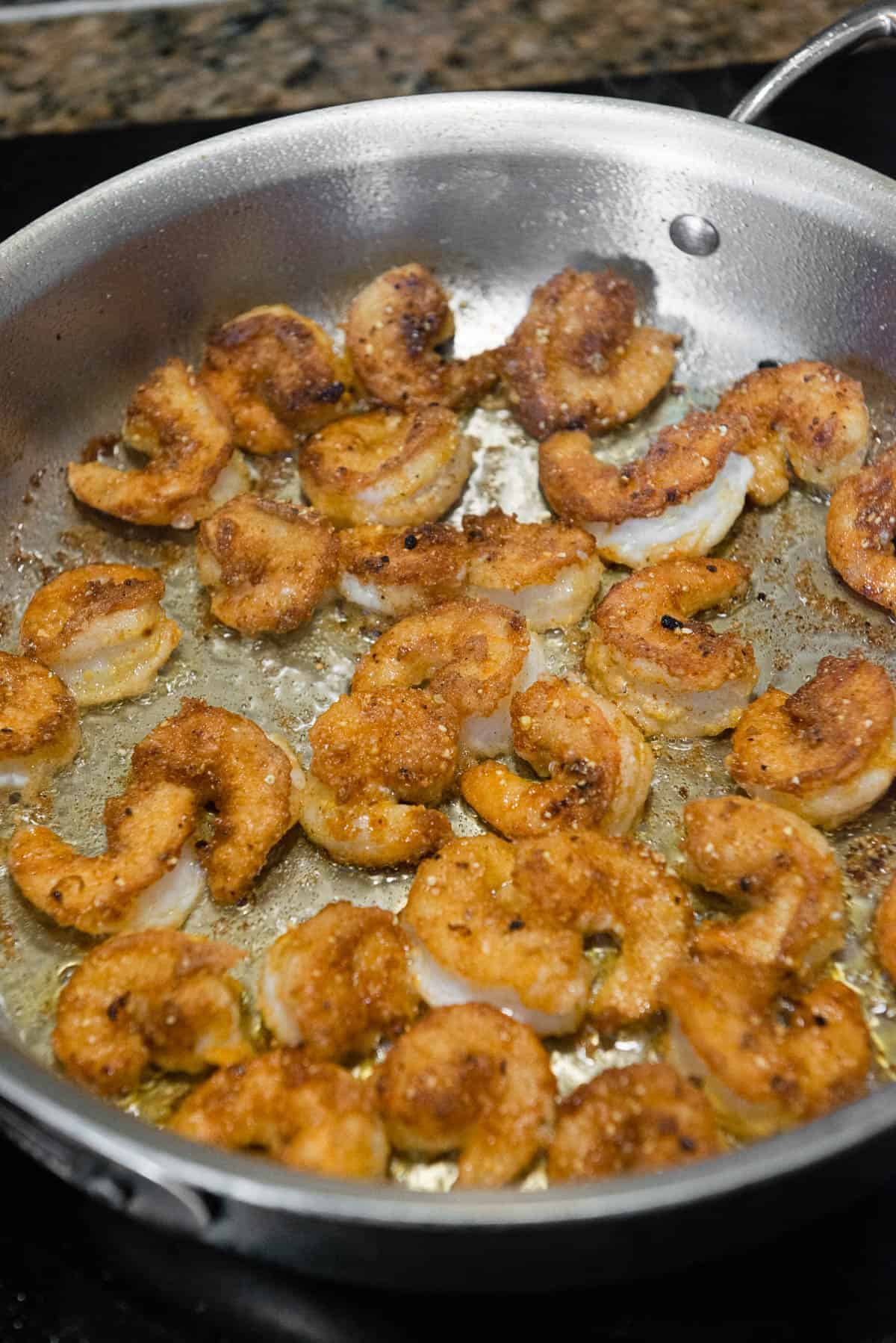 fried browned shrimp in pan