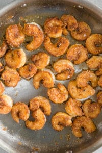 cooked fried breaded shrimp in pan