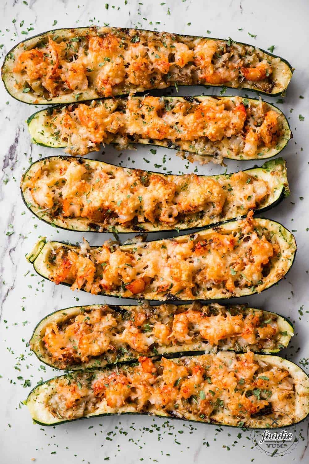 six shrimp zucchini boats with parmesan