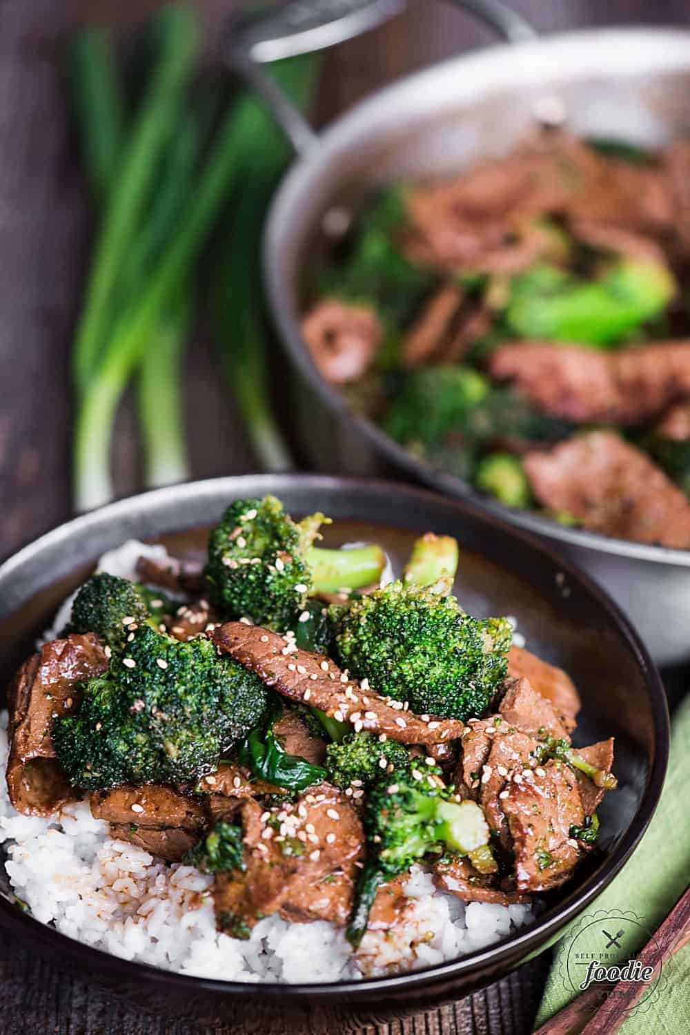 Beef and Broccoli stir fry in bowl over rice