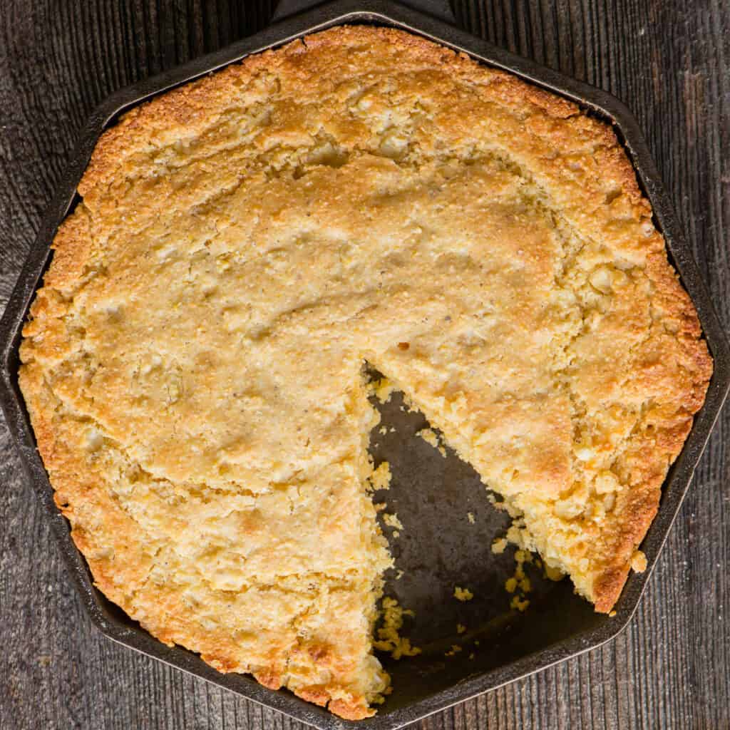skillet cornbread with slice taken out