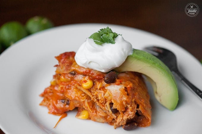 serving of homemade Slow Cooker Chicken Enchilada Casserole with avocado and sour cream