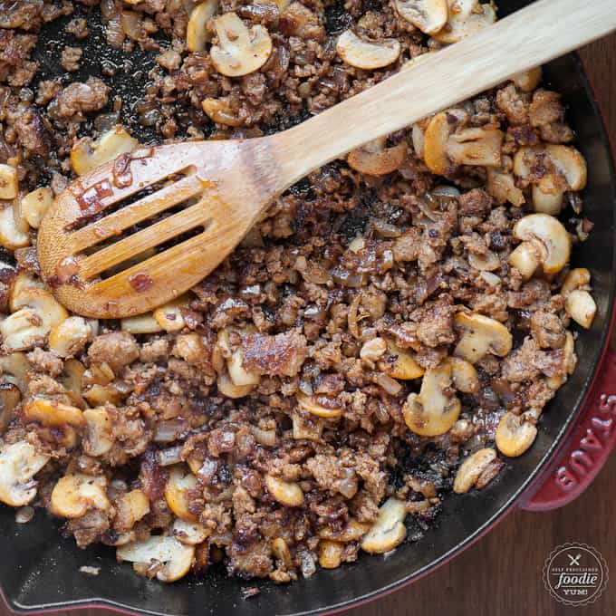 sausage and mushrooms in a pan