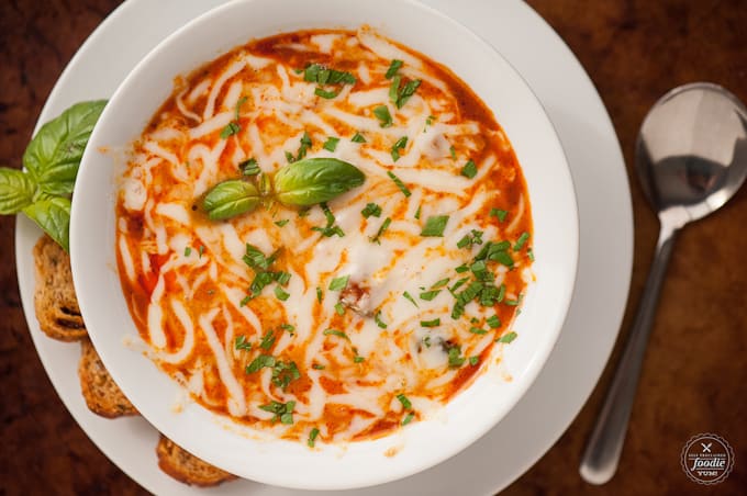 a bowl of lasagna soup, with cheese