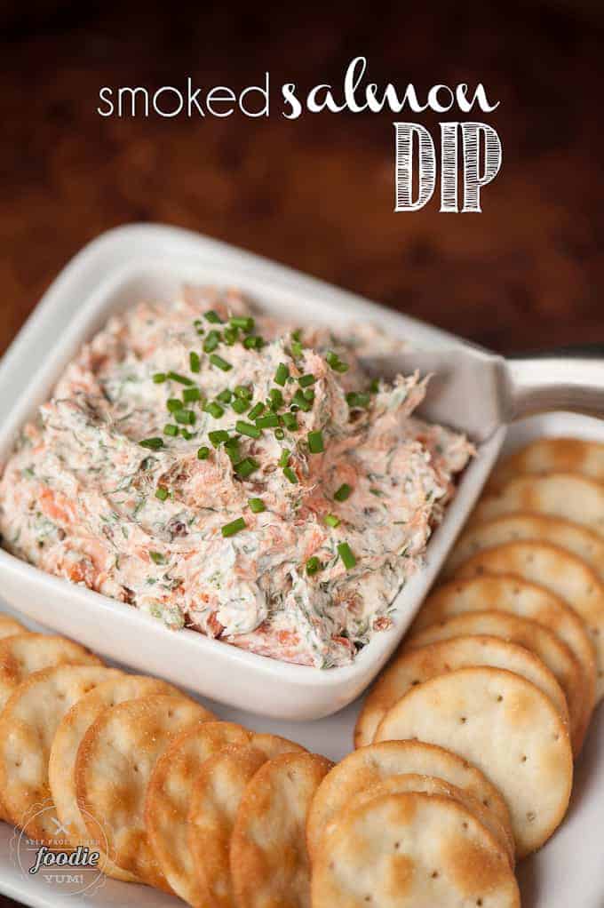 smoked salmon cream cheese dip in white square dish with crackers