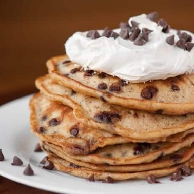 a stack of chocolate chip pancakes with marshmallow topping