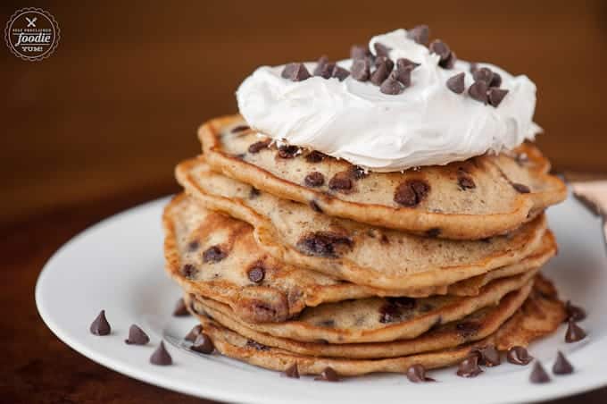 a stack of chocolate chip pancakes with marshmallow topping