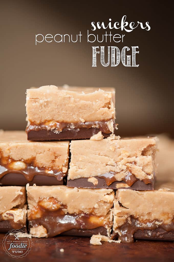 Stack of Microwave Snickers Peanut Butter Fudge with caramel, peanuts and chocolate