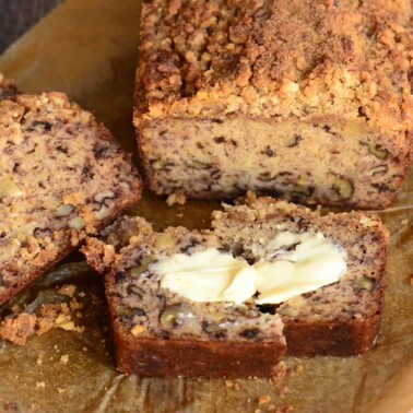 sliced homemade banana bread with butter