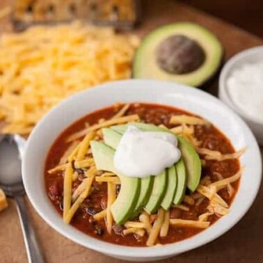 This spicy Southwestern Chili made with ground beef, chorizo, green chile, black and pinto beans is a hearty meal perfect for tailgating on game day!