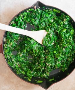 sauté of fresh spinach in pan