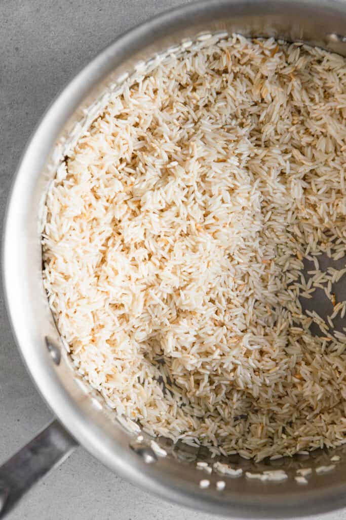 browning rice in pan.